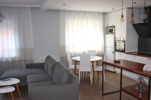 a living room with a couch and a table at Apt 16-Tirana Very Central Apartment in Tirana
