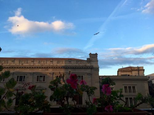 a building with a kite flying in the sky at Cosmopolitan B&B in Palermo