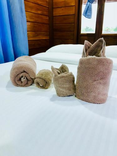 Ένα ή περισσότερα κρεβάτια σε δωμάτιο στο We Care Resort