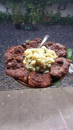 a plate of food sitting on the ground at Lörincz Vendégház in Corund