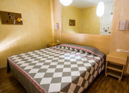 מיטה או מיטות בחדר ב-Apartamentos Orlando 85