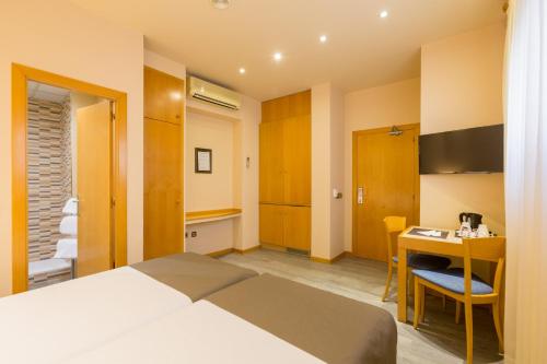 Cama o camas de una habitación en Apartamentos DV