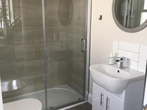 a bathroom with a shower and a sink at The Studio in Worthing