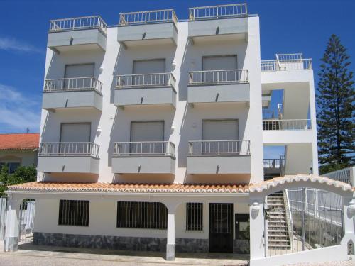 a white apartment building with balconies on it at Residencial Campo-Mar by Umbral in Portimão