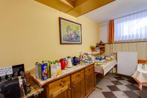 a kitchen with a counter with food on it at Rooms & Apartments Jana in Cerklje na Gorenjskem