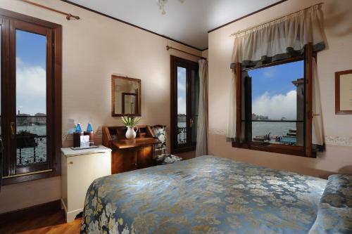 Postel nebo postele na pokoji v ubytování Hotel La Calcina