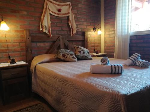 Postel nebo postele na pokoji v ubytování Cabañas Valentina