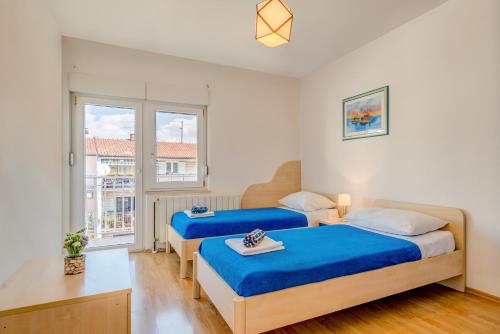 Katil atau katil-katil dalam bilik di Apartments Maestral