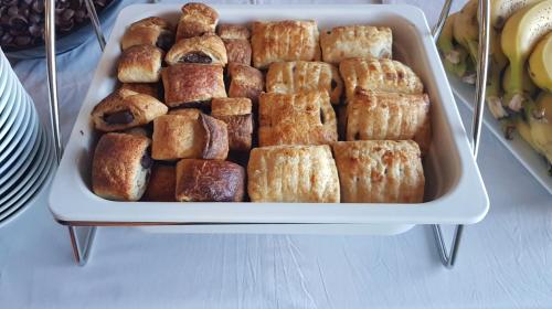 a tray full of pastries on a table at Hotel HF in Farellones