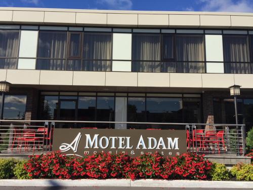 a hotelihad sign in front of a building at Motel Adam in Gatineau