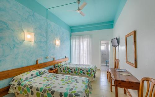 Кровать или кровати в номере Hotel La Terraza