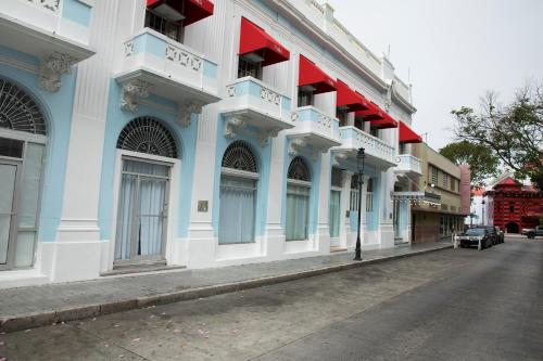 a blue and white building on the side of a street at Hotel Melia Ponce in Ponce
