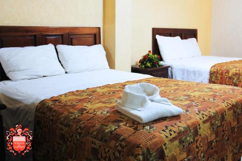 Un pat sau paturi într-o cameră la Posada del Marqués