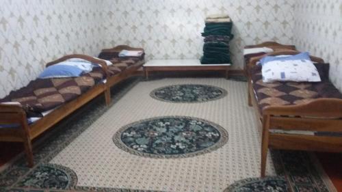 Postel nebo postele na pokoji v ubytování Hotel SUGD & Guest House