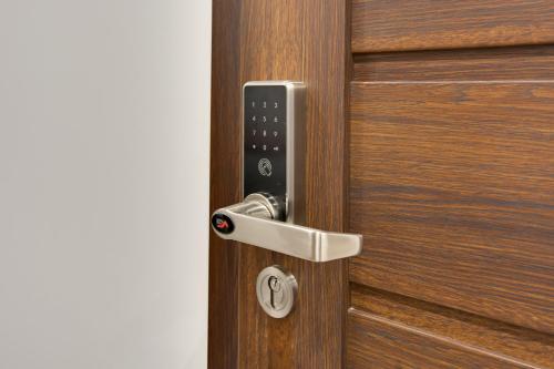 a close up of a wooden door with a handle at KATO Apartamenty Moniuszki in Katowice