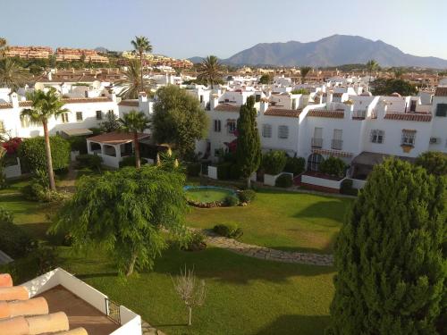 an aerial view of a city with white houses at Rio Manilva in San Luis de Sabinillas