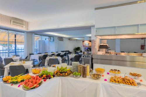 a table with food on it in a restaurant at Marina Palace Hotel 4 stelle S in Caorle