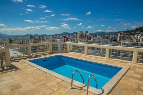 a swimming pool on the roof of a building at Rio Branco Hotel in Florianópolis