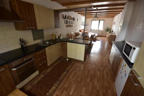 an overhead view of a kitchen with wooden cabinets at Privat BEA in Podtureň