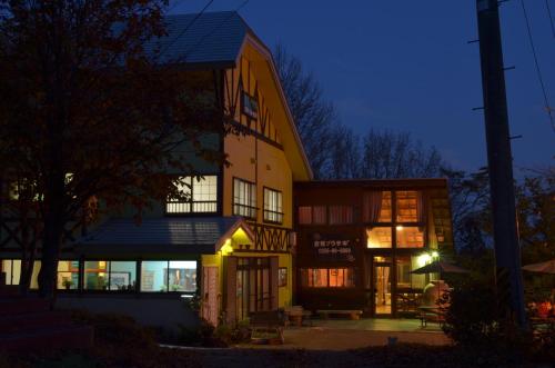 a building at night with lights on at Soratobu Usagi in Myoko