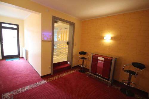 Postel nebo postele na pokoji v ubytování Hotel du Commerce - Restaurant La Table de Clervaux