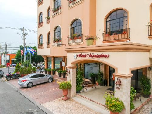 a building with a christmas sign on it at Hotel Monteolivos in San Pedro Sula