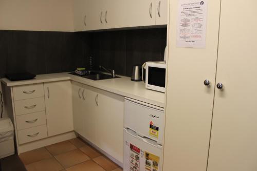 Η κουζίνα ή μικρή κουζίνα στο Box Hill Studio Apartment 2