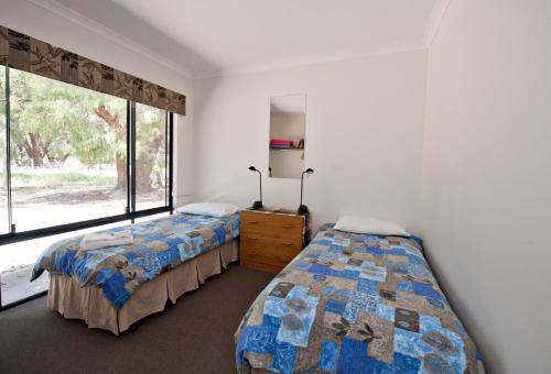 Postel nebo postele na pokoji v ubytování Margaret River Hideaway & Farmstay