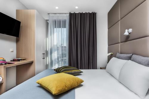 Posteľ alebo postele v izbe v ubytovaní Nymphes Deluxe Accommodation Pefkochori