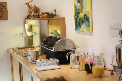 a counter top with some drinks on it at Wellness Pension Hollaus in Kirchberg in Tirol
