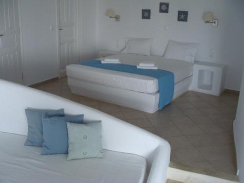 Ein Bett oder Betten in einem Zimmer der Unterkunft Solaris