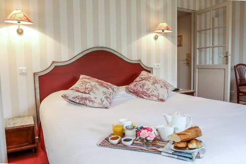 Un ou plusieurs lits dans un hébergement de l'établissement Best Western Hotel Le Guilhem