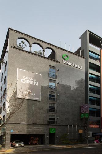 a building with a sign for a music hotel at Hotel Mate Bundang in Seongnam