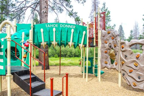 a playground with a slide and a play structure at Ski View Majesty in Truckee