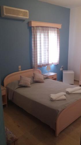 Cama o camas de una habitación en Ifigenia Hotel