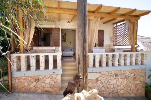 a porch of a house with a wooden fence at Villa Rospovi in Kaligata