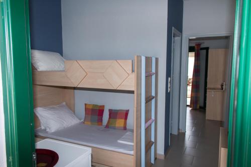 a couple of bunk beds in a room at Elina Apartments in Parga