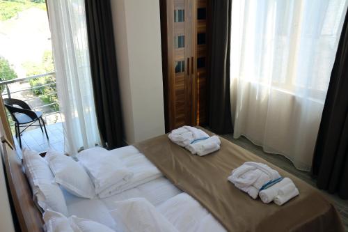 Postel nebo postele na pokoji v ubytování Hotel Lazi