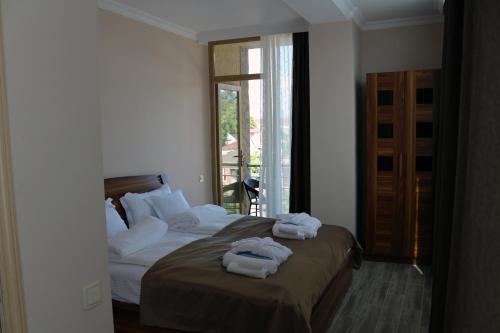 Кровать или кровати в номере Hotel Lazi