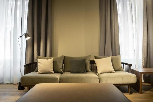 a living room with a couch and a table at ICON Embassy in Madrid
