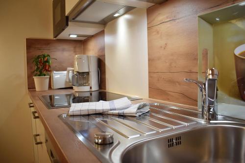a kitchen with a sink and a coffee maker at Haus Partale in Oberstdorf