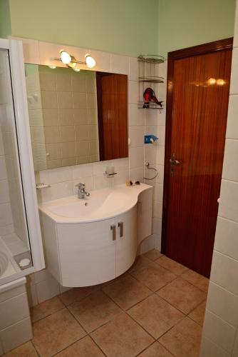 a bathroom with a sink and a mirror at Alloggio nonna Cornelia in Citta' Sant'Angelo
