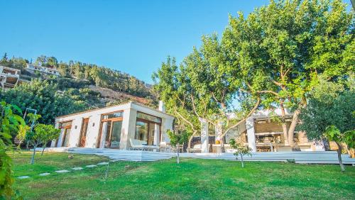a house with a garden in front of it at Icons Sea of Crete in Malia