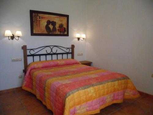 A bed or beds in a room at Alojamientos Rurales La Higuerilla Sierra de Cazorla