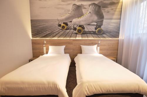 מיטה או מיטות בחדר ב-Active Hotel