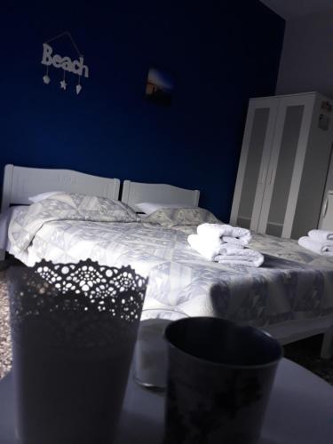Postel nebo postele na pokoji v ubytování Meerithic ROKKA ROOMS