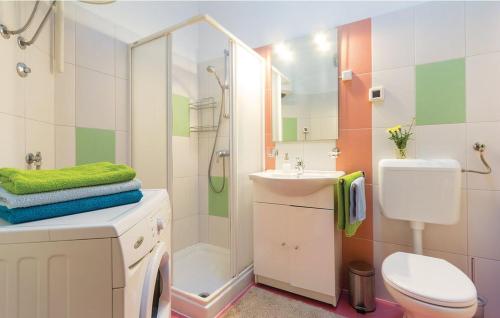 a bathroom with a toilet sink and a shower at Apartment for Two 200m from the Beach in Pula
