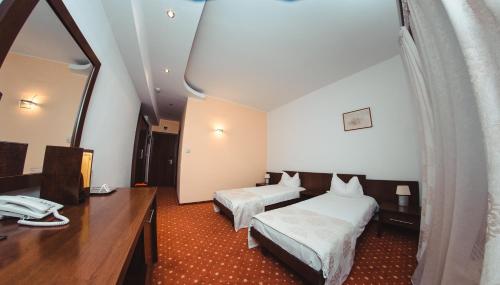 Postel nebo postele na pokoji v ubytování Celly Hotel