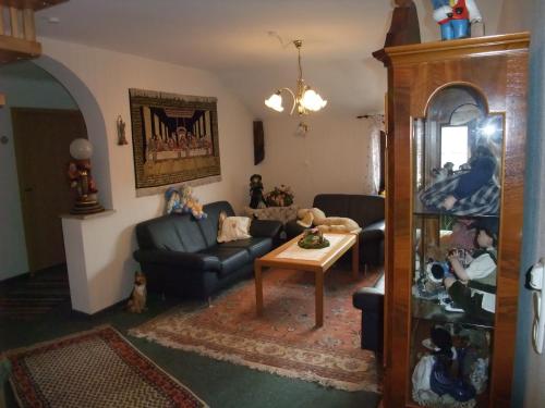 a living room with a couch and a table at Gasthof Alte Post in Obertrubach