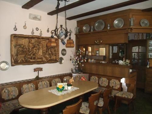 a dining room with a table and chairs at Gasthof Alte Post in Obertrubach
